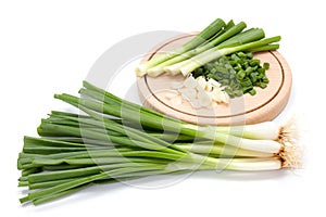 Freshly cut green onion on cutting board