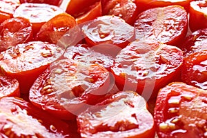 Freshly cut juicy red cherry tomatoes