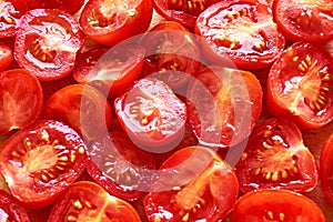 Freshly cut juicy red cherry tomatoes