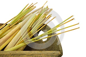 Freshly cut lemon grass(sereh) in a wooden basket photo