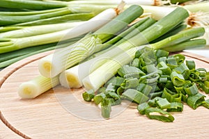 Freshly cut scallion on cutting board