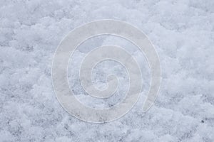 Freshly fallen soft snow, texture of fluffy white snow in winter, close up, top view