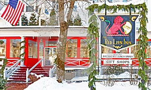 freshly fallen white snow on entrance to Red Lion Inn decorated for Christmas