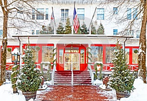 freshly fallen white snow on entrance to Red Lion Inn decorated for Christmas