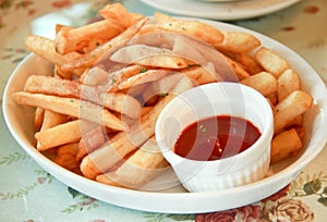 Freshly french fries with ketchup (tomato sauce)