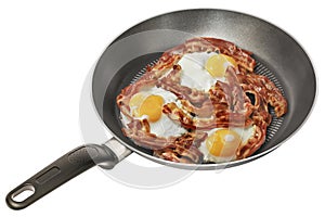 Freshly Fried Bunch of Crispy Bacon and Sunny Side Up Eggs in Non-Stick Frying Pan Isolated on White Background