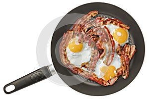 Freshly Fried Crispy Bacon and Eggs in Non-Stick Frying Pan Isolated on White Background