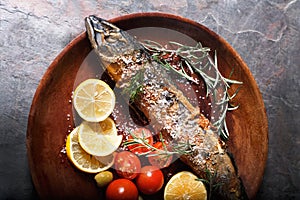 Freshly fried fish with vegetables and spices