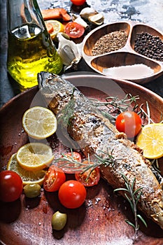 Freshly fried fish with vegetables and spices