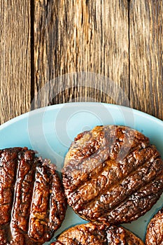 freshly grilled burger meat close-up, copy space, top view,