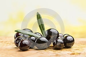 freshly harvested black olives on the olive table