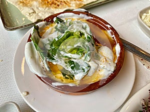 Freshly harvested cibes grass with yogurt and olive oil