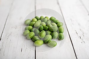 Freshly harvested cucamelons, Mexican sour gherkin pepquino or mouse melon.