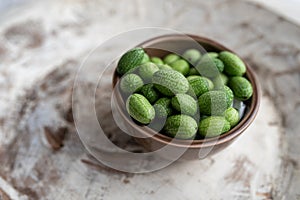 Freshly harvested cucamelons, Mexican sour gherkin pepquino or mouse melon.