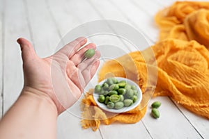 Freshly harvested cucamelons, Mexican sour gherkin pepquino or mouse melon.