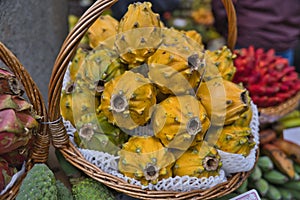 Freshly harvested yellow pitaya, pitahaya or dragon fruit, cactus fruit on market in Funchal, Madeira Islands, Portugal