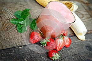 Freshly and healthy beverage (drink), banana - strawberry smoothie in glass