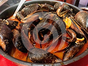 Mussels with spicy sauce in a restaurant in Madrid, Spain.