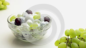 Freshly made grape salad with sour cream dressing in a glass bowl