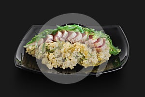 Freshly made Japanese rice served with pieces of fish and wakame