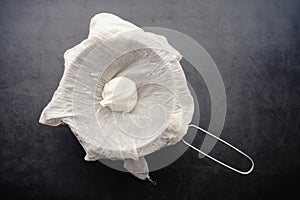 Freshly Made Labneh Cheese in a Cheesecloth Lined Strainer