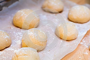Freshly made white bread rolls proving