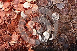 Numismatic background of uncirculated cents and nickels photo