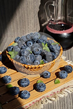 Freshly picked blueberries in a wicker basket - Juicy and fresh blueberries - Blueberry antioxidant.