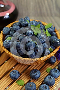 Freshly picked blueberries in a wicker basket - Juicy and fresh blueberries - Blueberry antioxidant.