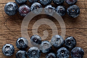 Freshly picked blueberries in wooden background. Juicy and fresh blueberries