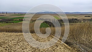 Freshly plowed field. Arable land with fertile soil for planting wheat. Rural landscape in Serbia, Balkans, namely Fruska Gora