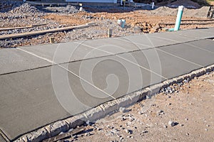 freshly poured cement sidewalk