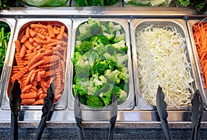 Freshly Prepared Baby Carrots, Broccoli and Shredded Cabbage in a Salad Bar