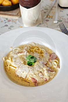 A Freshly Prepared and Delicious Spaghetti Carbonara Served on the Dining Table