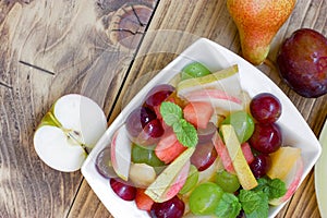Freshly prepared healthy vegetarian food made with organic fruit, fruit salad