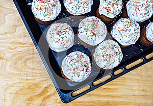 Freshly prepared in the oven Easter cakes on a black baking sheet. Happy easter