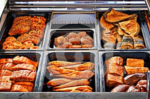 Freshly prepared smoked fish in a sales stand photo