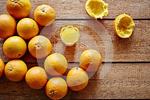 Freshly pressed orange juice and bunch of oranges