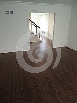 Freshly refinished red oak hardwood flooring, stained medium brown and 3 coats of bona HD satin