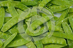 Freshly rinsed raw snap peas