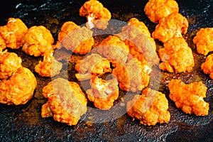 Freshly Roasted Buffalo Cauliflower Bites on a Sheet Pan