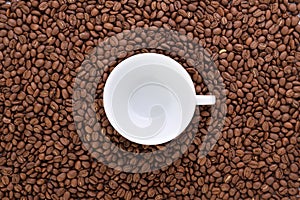 Freshly roasted coffee beans background top view isolated on white background with coffee cup using for your advertising