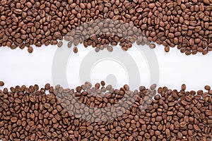 Freshly roasted coffee beans background top view isolated on white background with top copy space using for your advertising