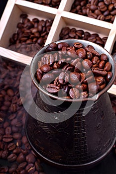 Freshly roasted coffee beans in a cezve