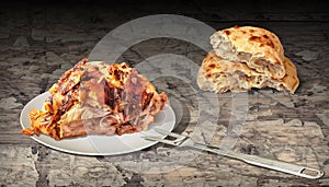 Freshly Roasted Pork Ham and Domestic Pita Bread Loaf Served on Rustic Old Weathered Flaky Pinewood Table Vignette Backdrop