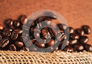 Freshly roasted scattered dark coffee beans