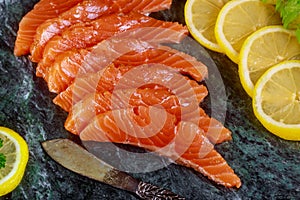 Freshly salmon with lime, avocado on a marble plate horizontal