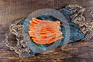 Freshly salmon sliced with close-up on a plate