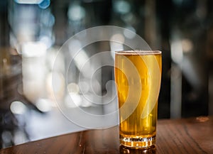 A freshly served IPA sitting on a table