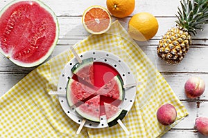 Freshly slice watermelon on sticks refreshment on the table